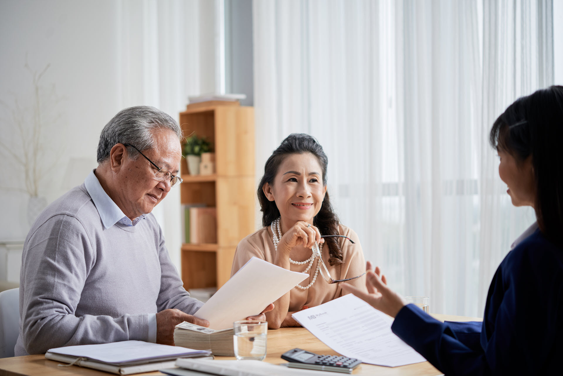 Older couple consulting with advisor