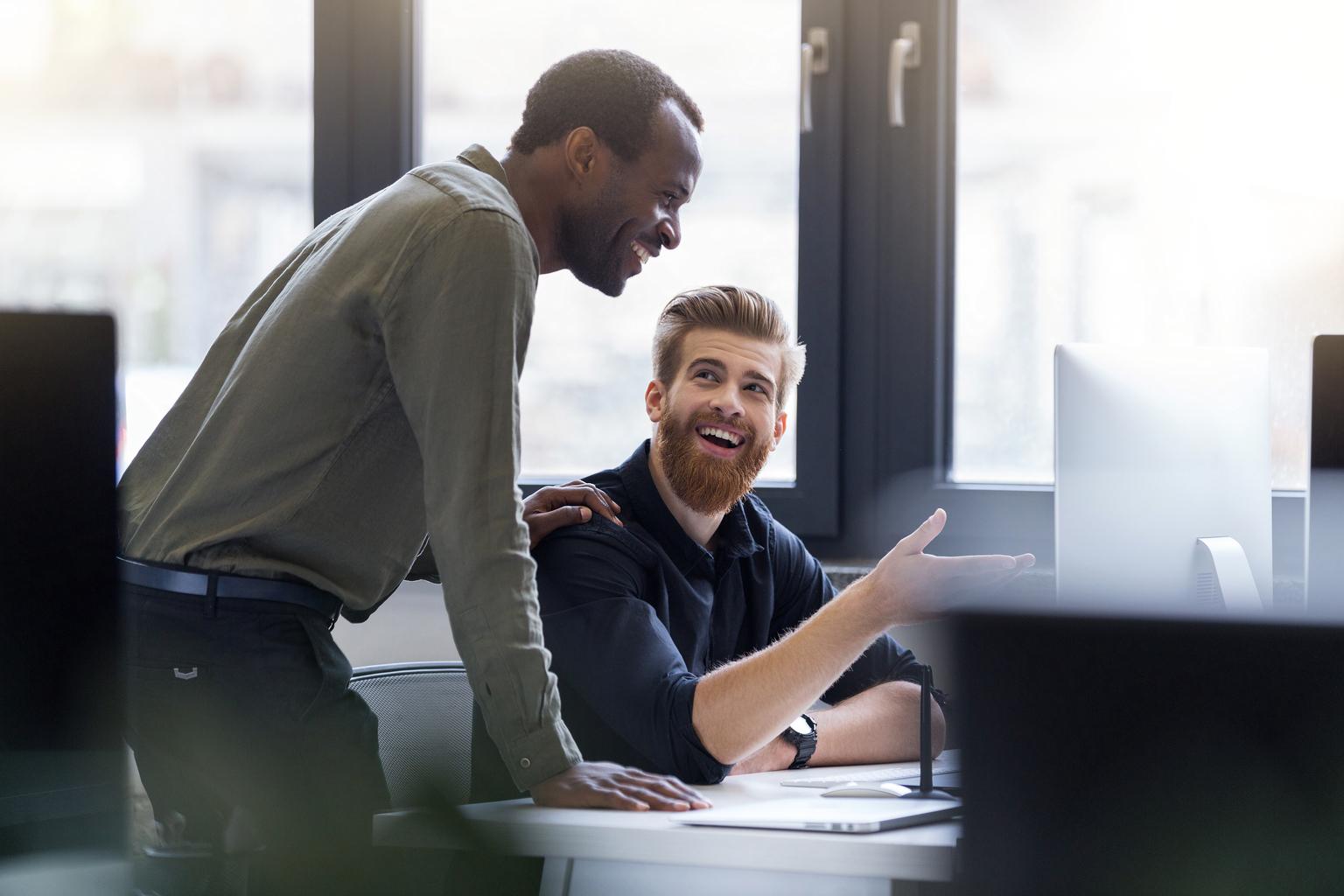Two men work on business project