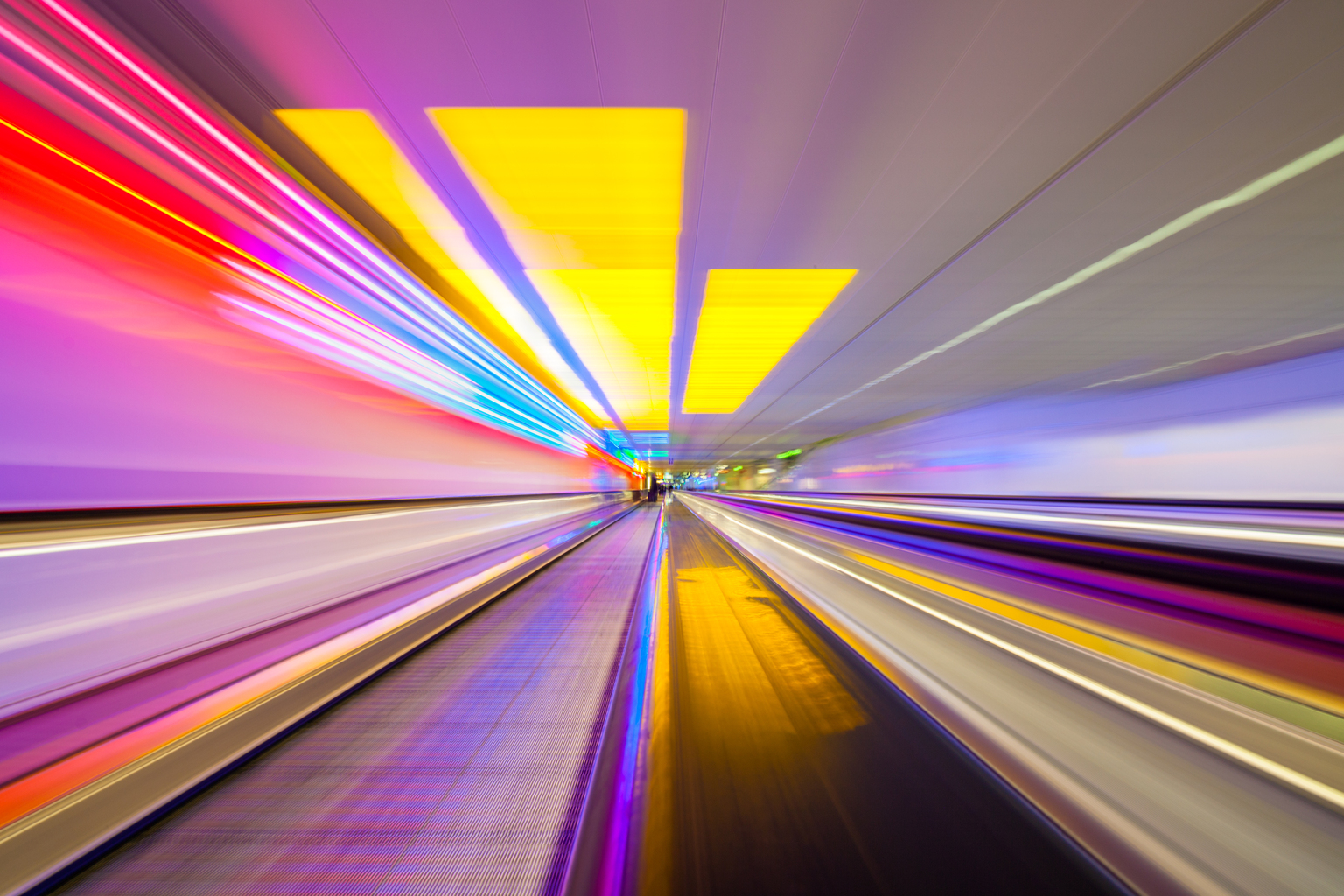 Blurred Motion Of Train At Illuminated Subway Station